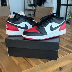 Nike Air Jordan 1 Black, Red, and White Low-Top Sneakers
